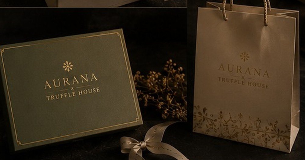 An Aurana corporate gift box with card and carrier bag